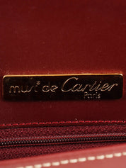 Logo embossed clutch bag in burgundy