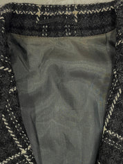 Check pattern double-breasted jacket in charcoal gray, white, and black