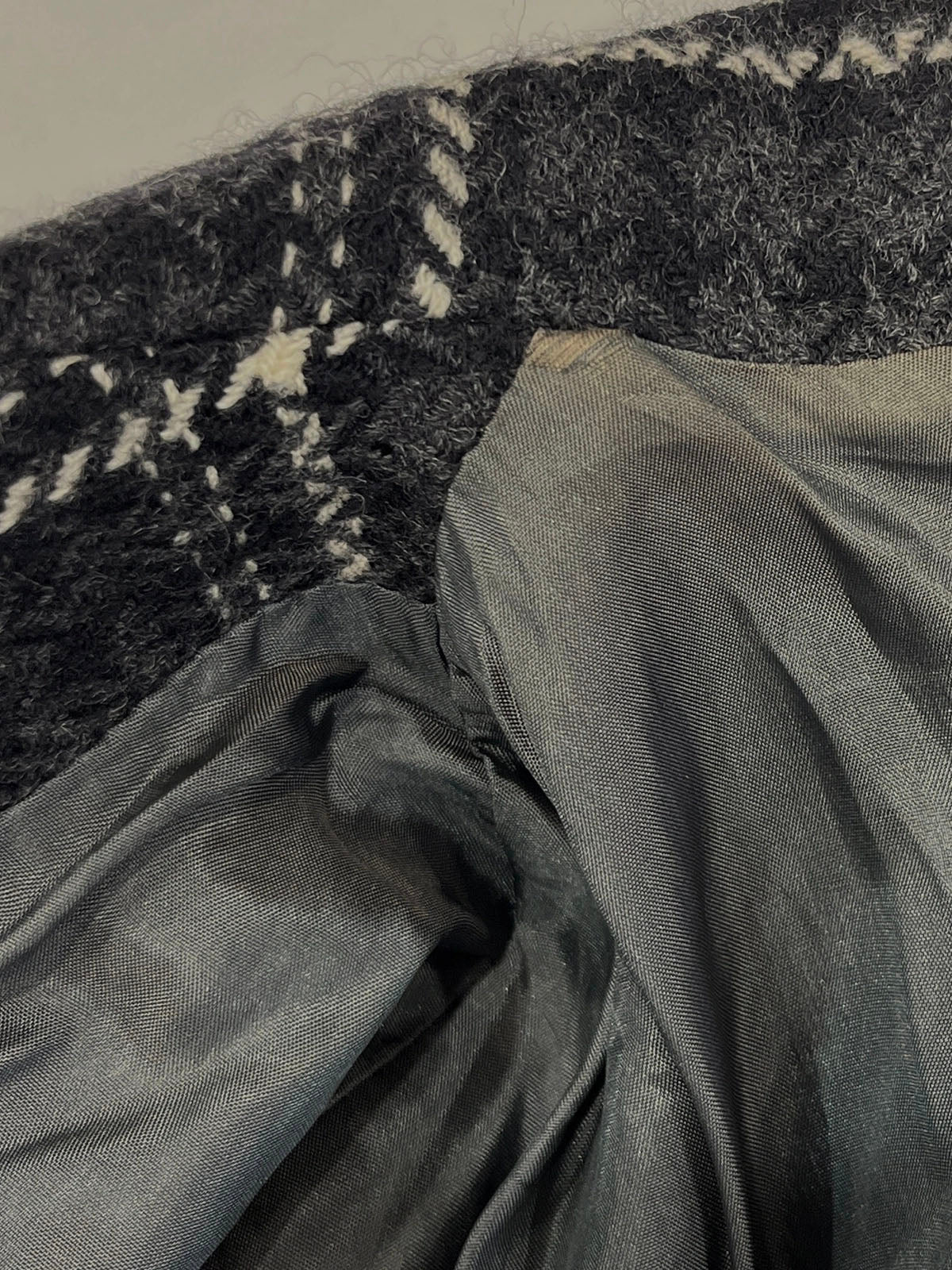 Check pattern double-breasted jacket in charcoal gray, white, and black