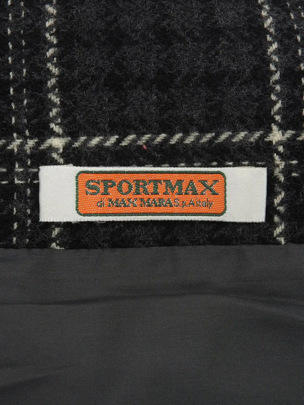 Check pattern double-breasted jacket in charcoal gray, white, and black