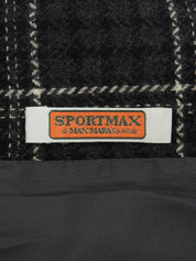 Check pattern double-breasted jacket in charcoal gray, white, and black