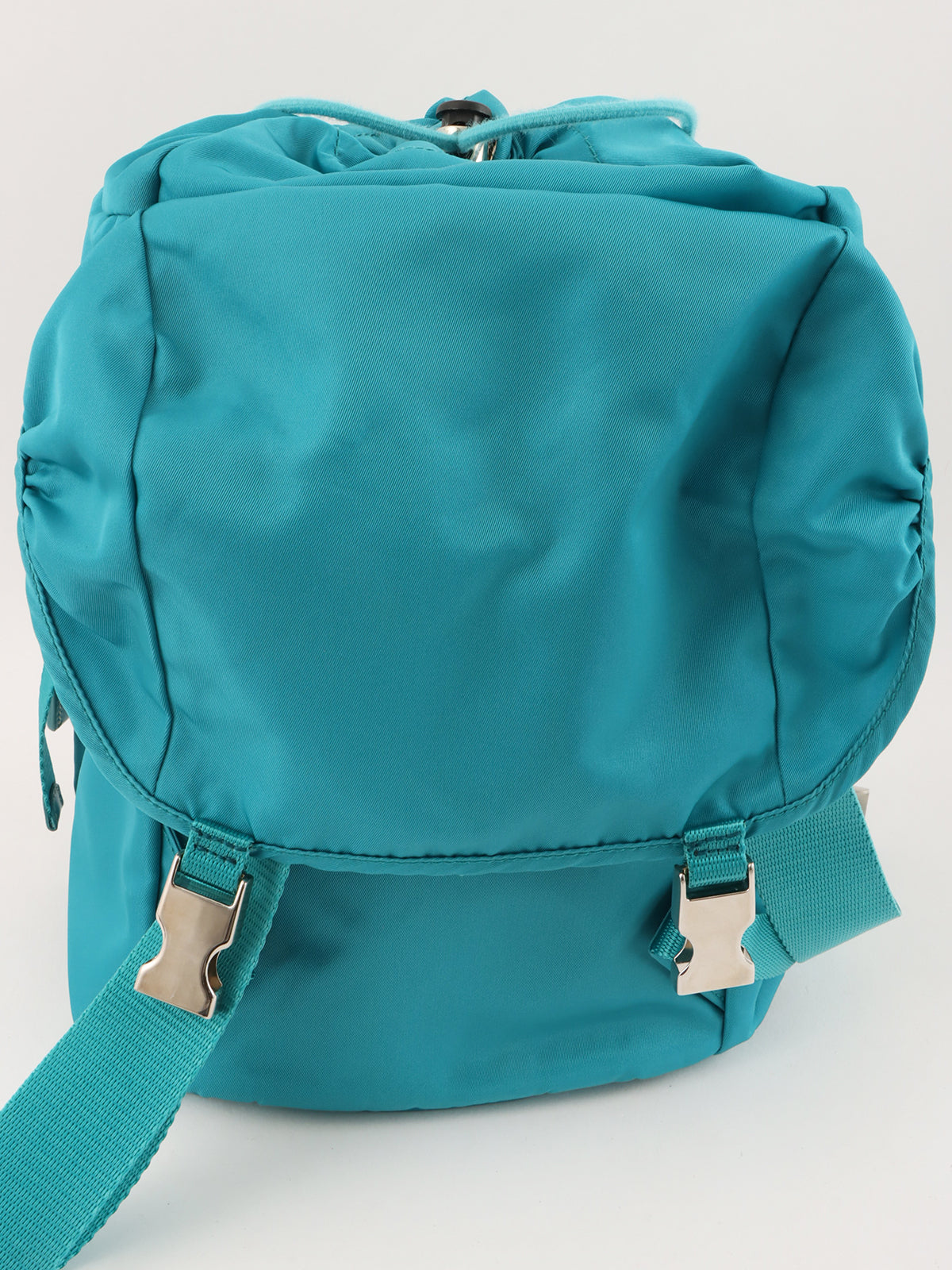 ナイロンロゴプレートバックパック ターコイズブルー