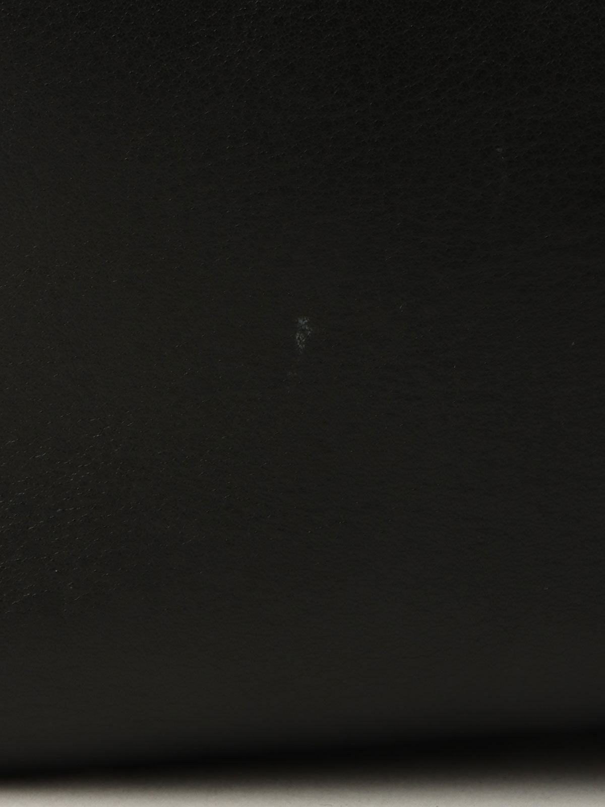 Anagram Embossed One-Shoulder Bag in Black