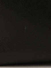 Anagram Embossed One-Shoulder Bag in Black