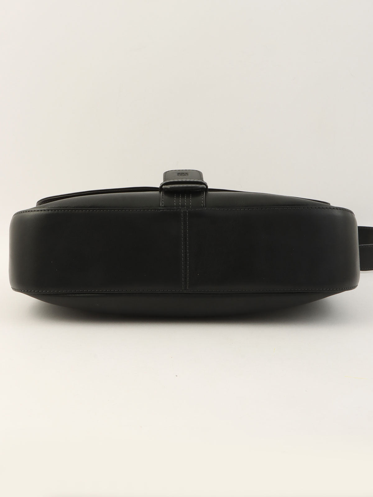 Anagram Embossed One-Shoulder Bag in Black