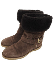 Monogram pattern sheepskin boots in brown