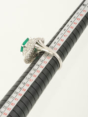 Platinum emerald and diamond ring in silver/green