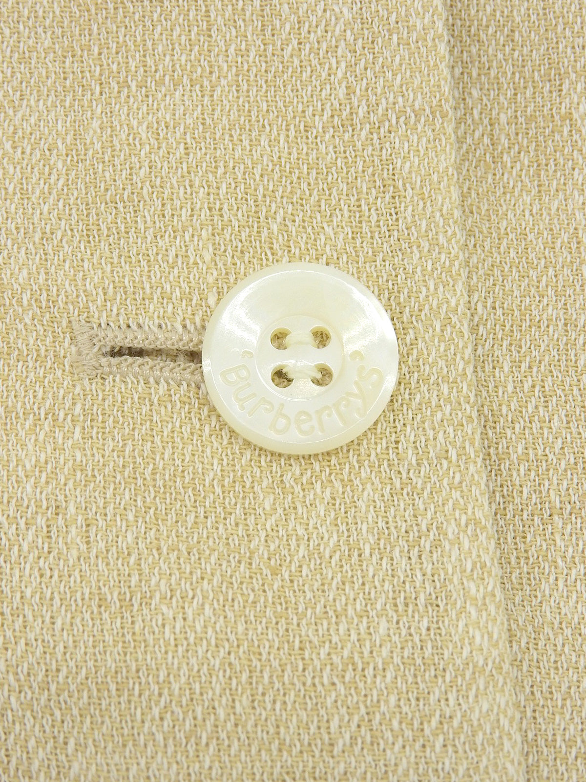 Linen logo button set up in ivory