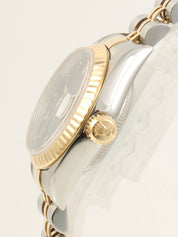 约1993年蚝式恒动日历型腕表，银/金/海军蓝配色。