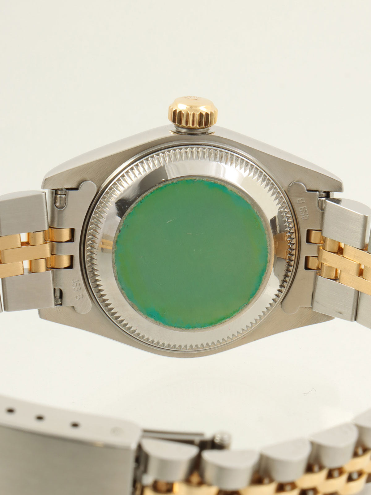 约1993年蚝式恒动日历型腕表，银/金/海军蓝配色。