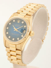 1990-1991年款 10P 钻石蚝式恒动日历型腕表，金/蓝表盘