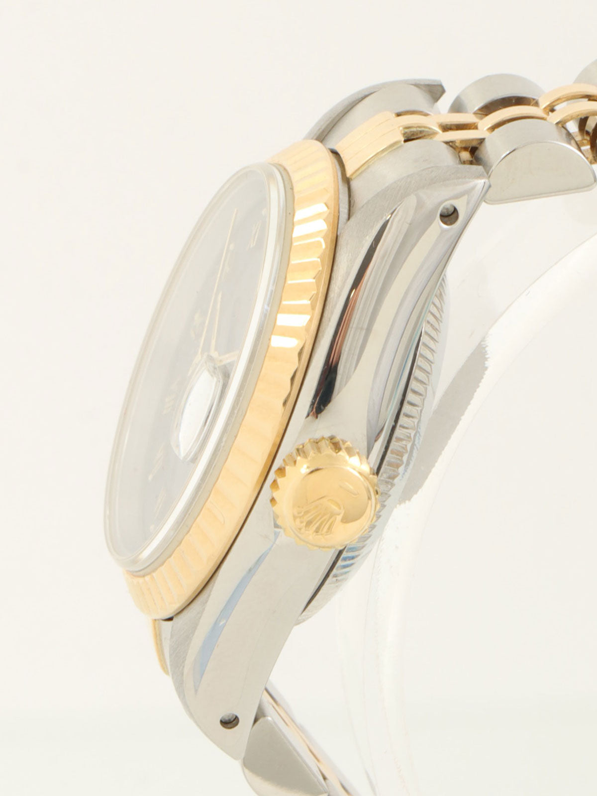 约1991年产蚝式恒动日历型腕表，银/金/海军蓝配色。