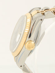 约1991年产蚝式恒动日历型腕表，银/金/海军蓝配色。