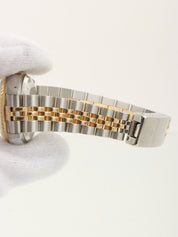 约1991年产蚝式恒动日历型腕表，银/金/海军蓝配色。