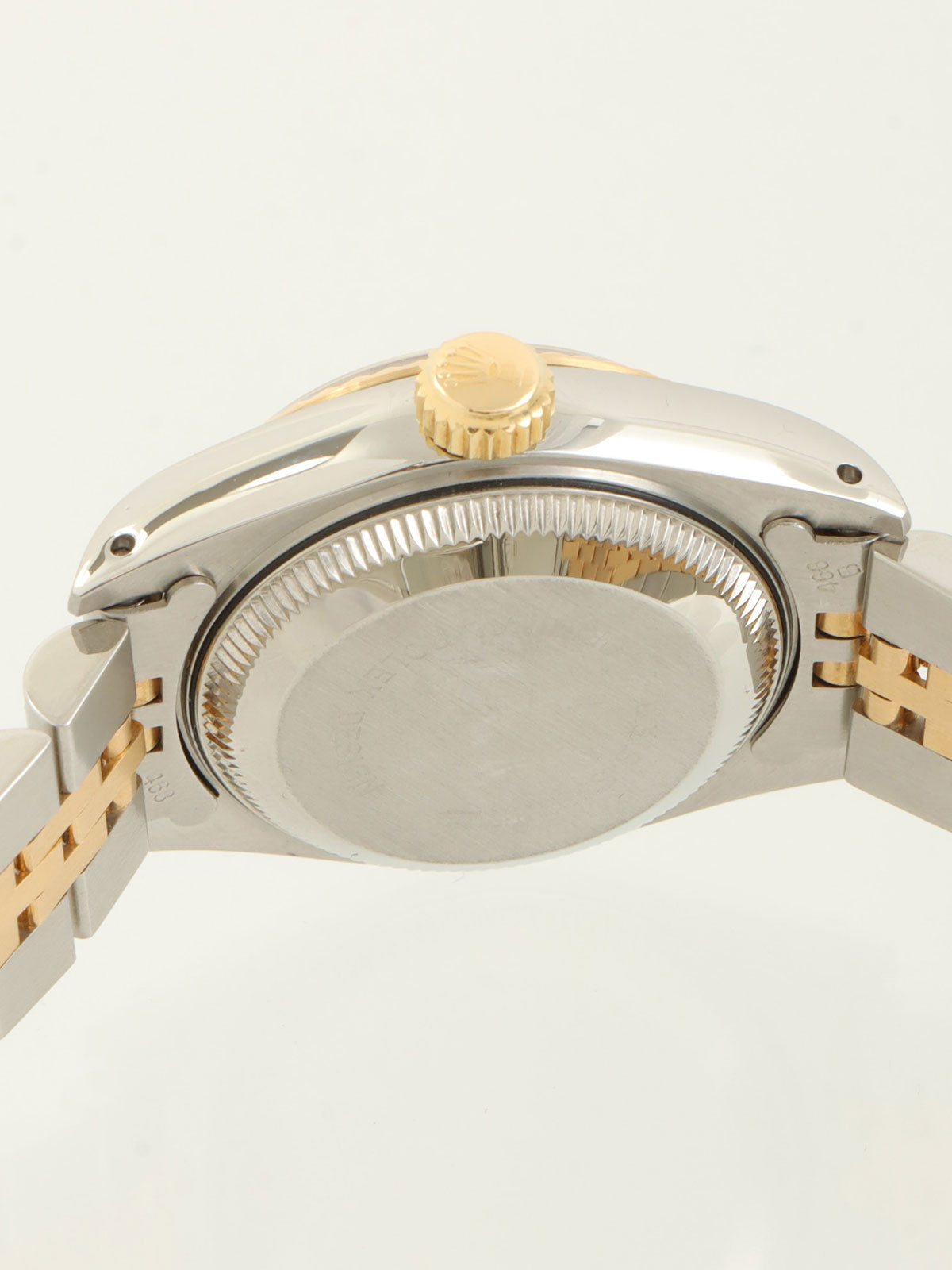 约1991年产蚝式恒动日历型腕表，银/金/海军蓝配色。