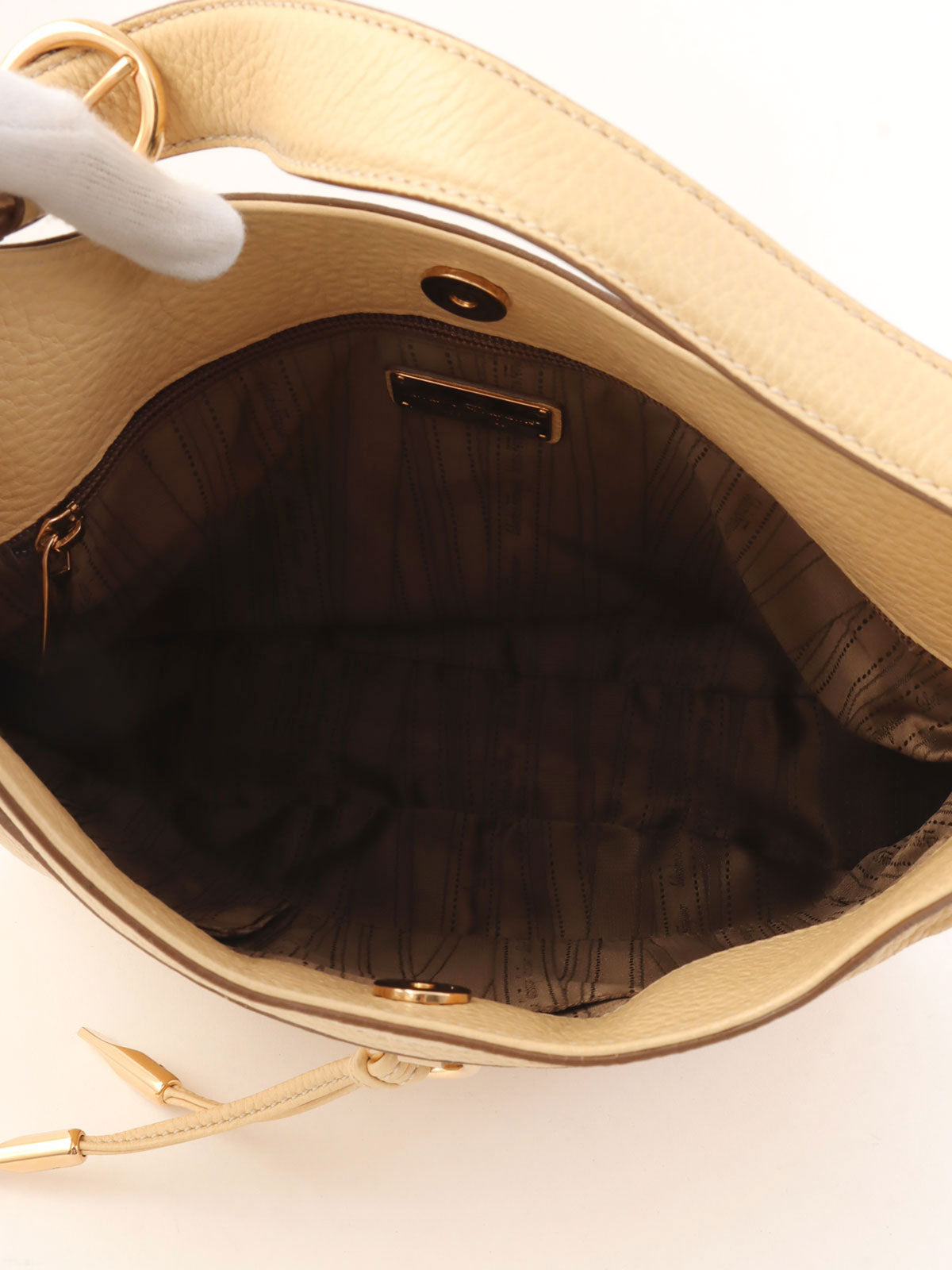 Gancini logo plate one-shoulder bag in beige