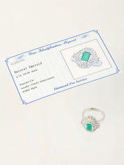 Platinum emerald and diamond design ring in silver/green