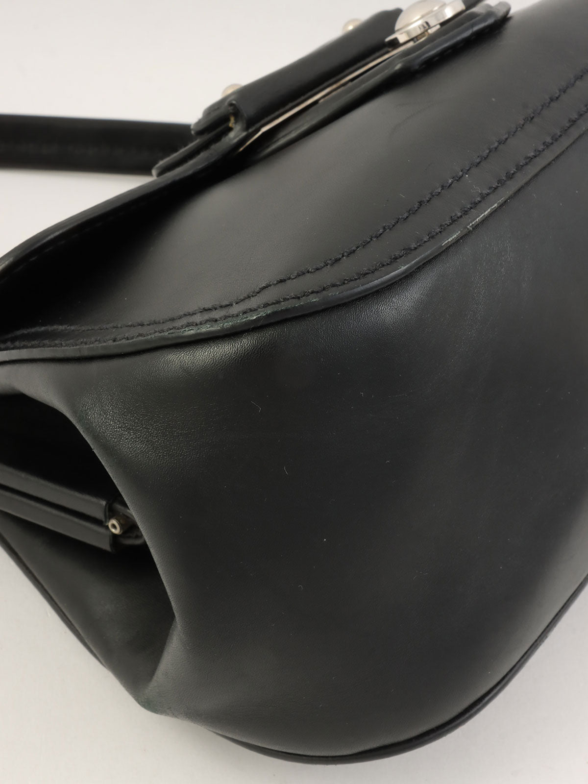 Logo Embossed Clasp Handbag in Black