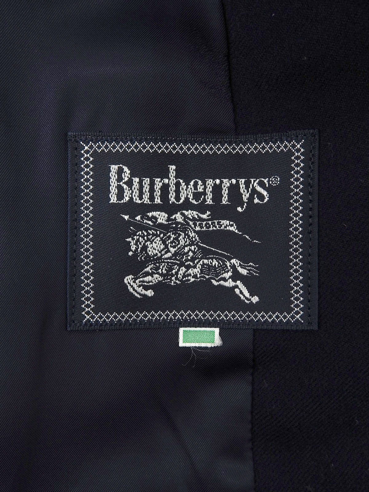 Navy double-breasted jacket with logo emblem patch