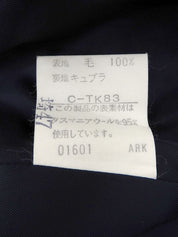 Navy double-breasted jacket with logo emblem patch