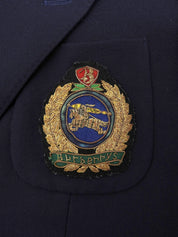 Navy double-breasted jacket with logo emblem patch