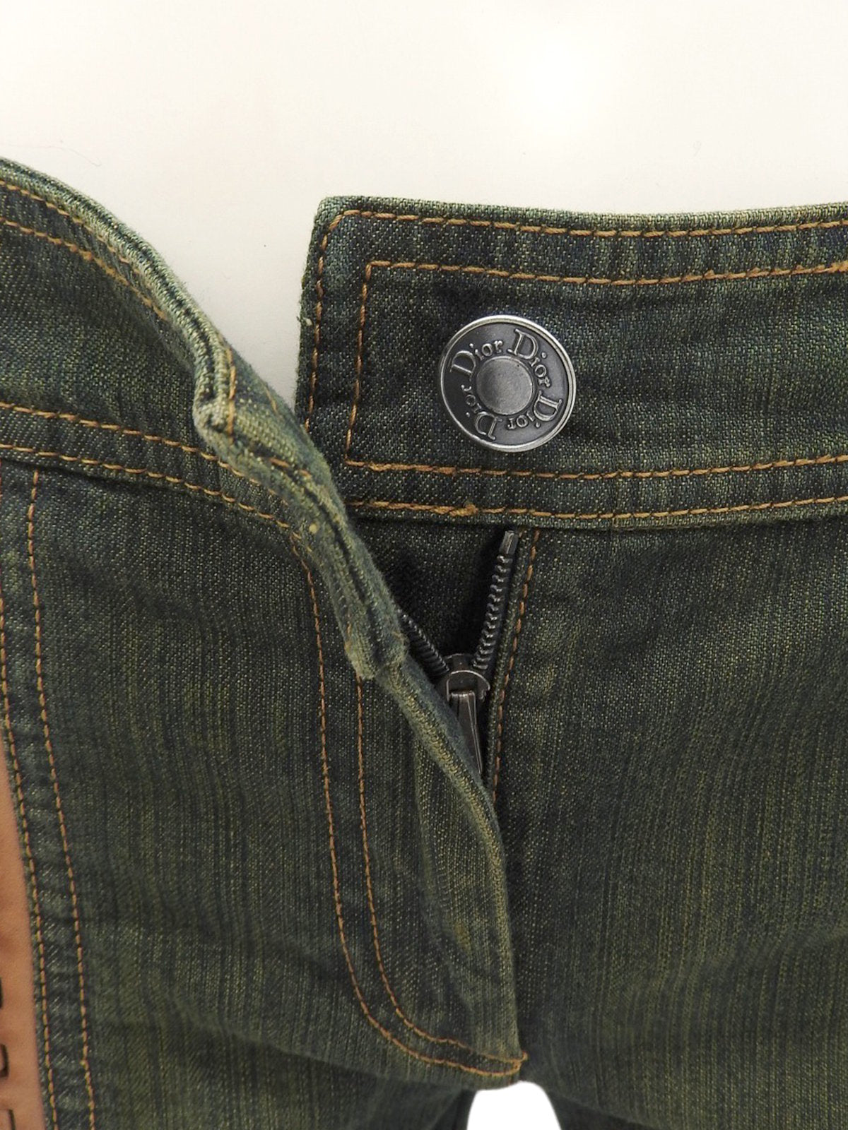 Leather Patchwork Logo Button Denim Pants in Indigo/Brown