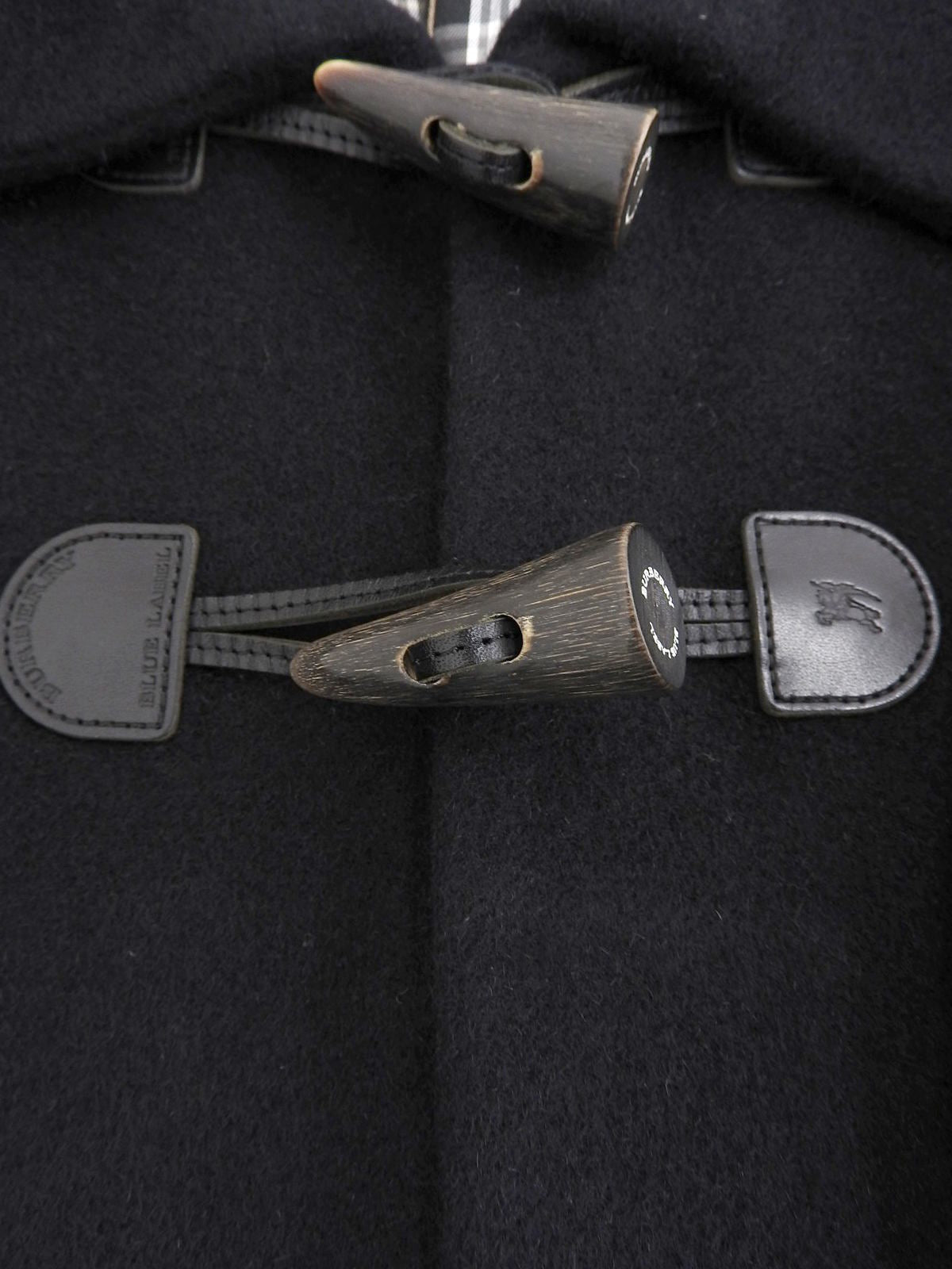 Angora Logo Embossed Poncho in Black