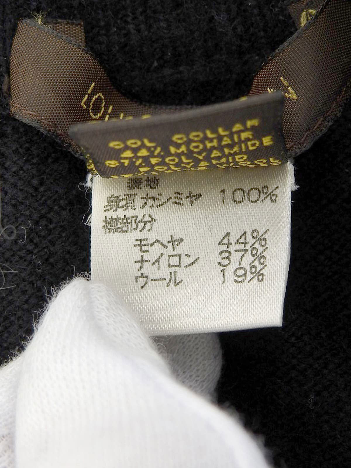 Cashmere ruffle design short sleeve knit top in black/white