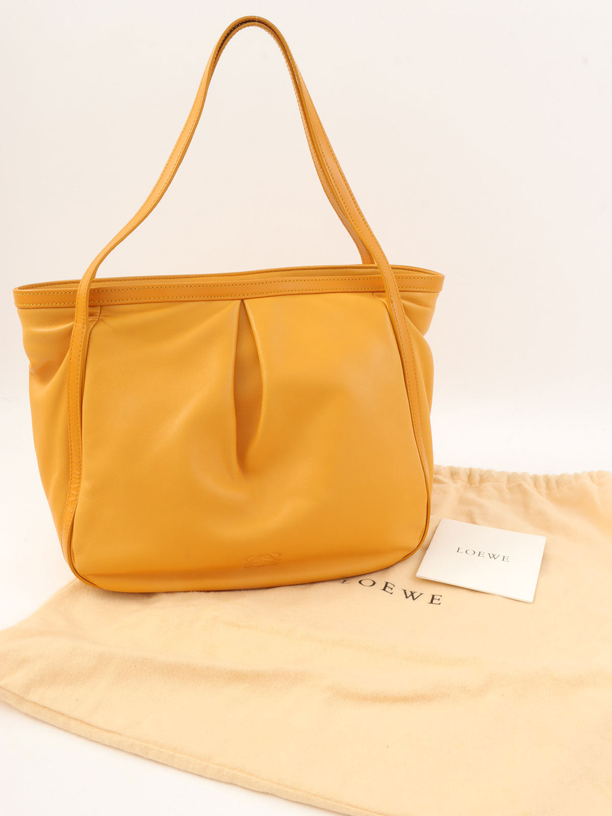 Anagram Embossed Shoulder Bag in Yellow