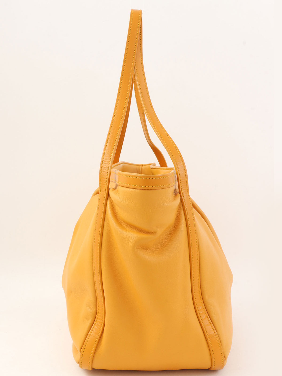 Anagram Embossed Shoulder Bag in Yellow