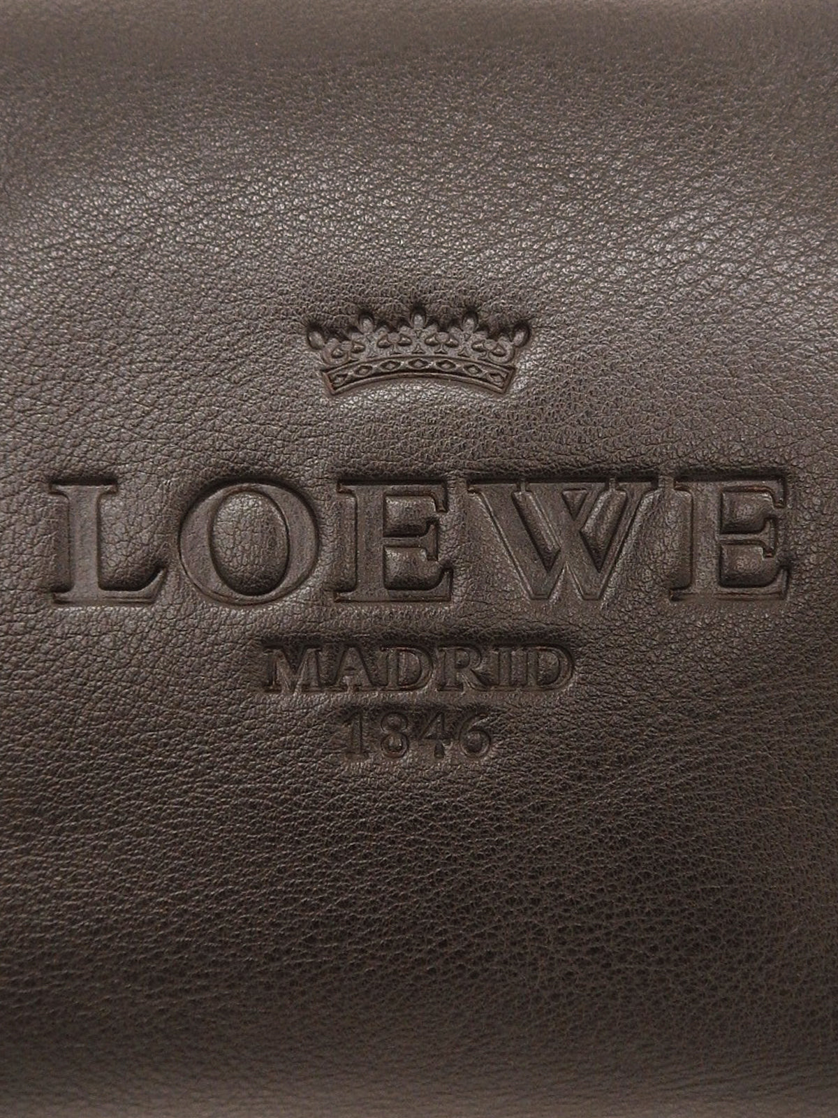 Logo embossed handbag in dark brown