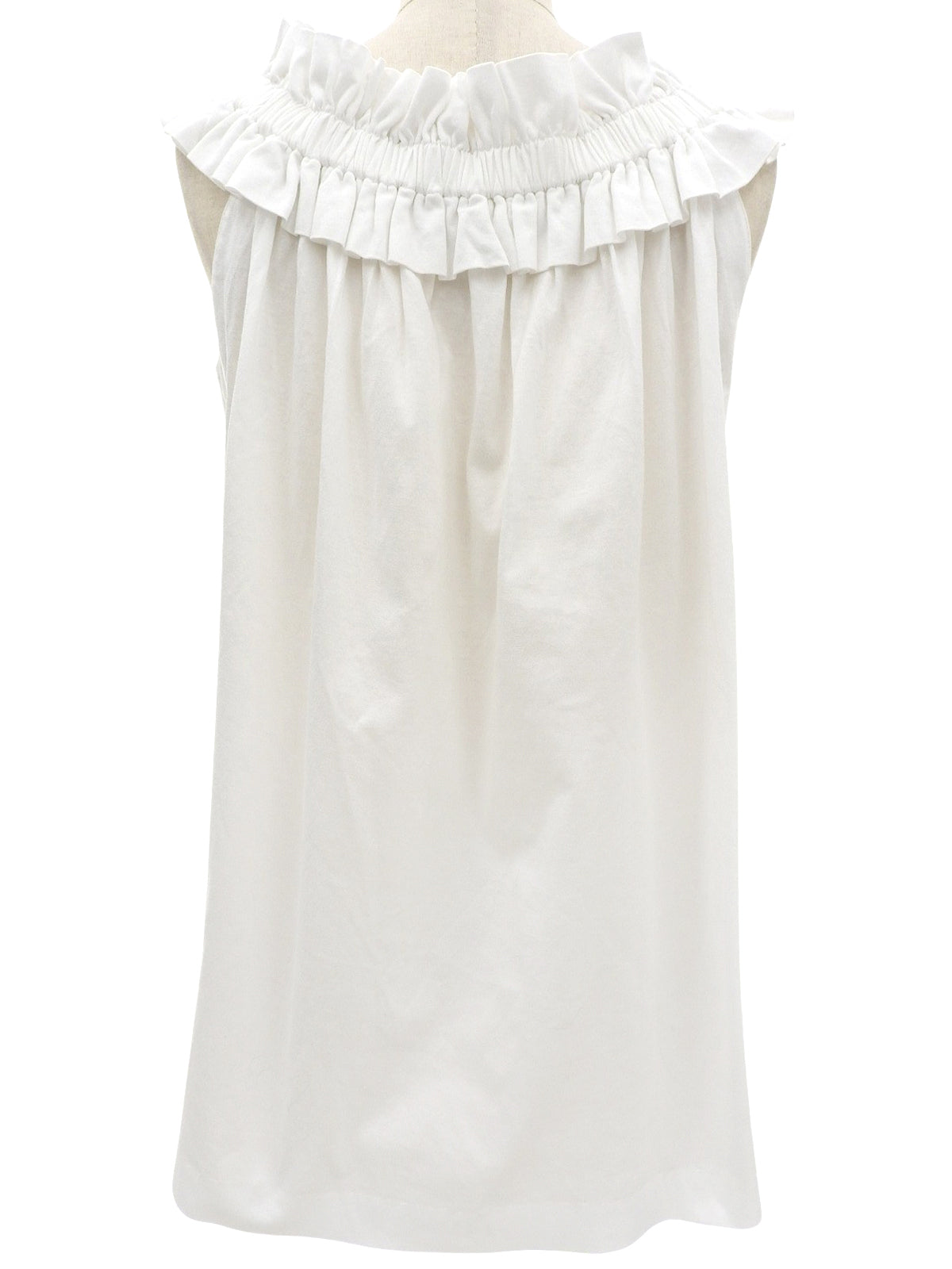 White ruffle sleeveless top