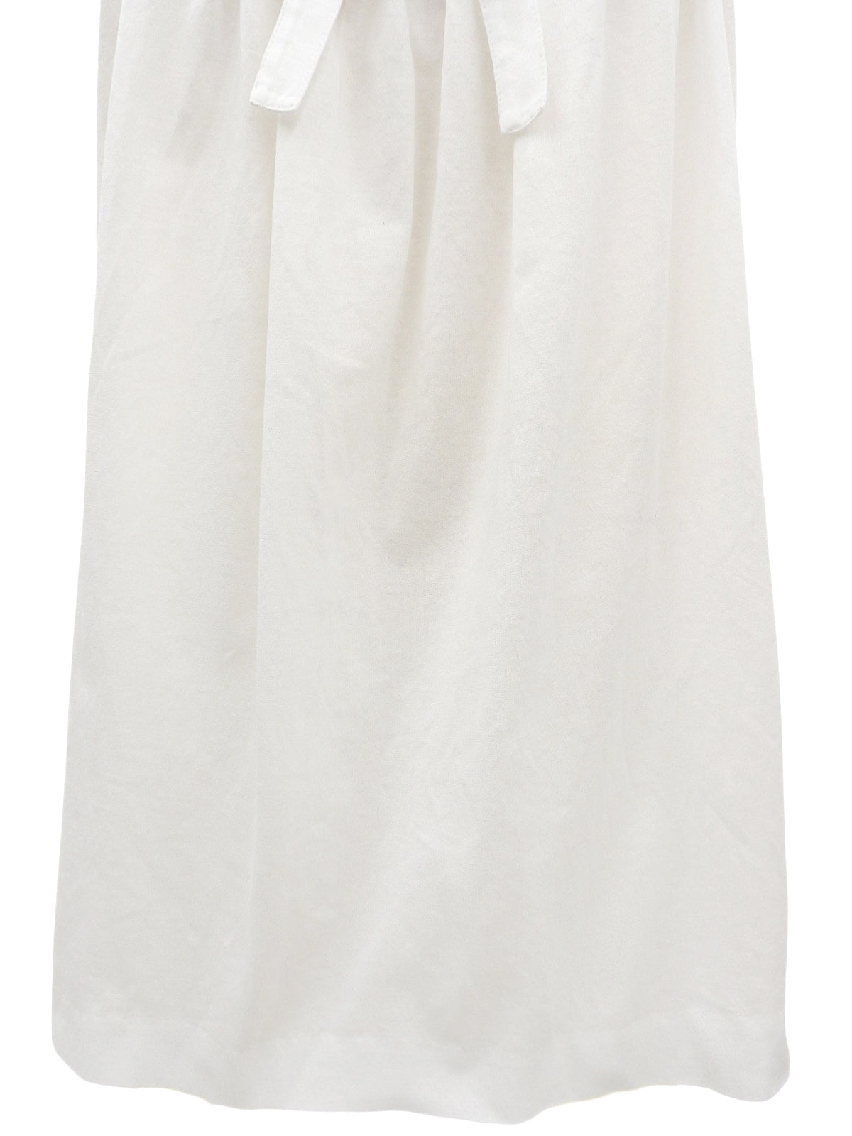 White ruffle sleeveless top
