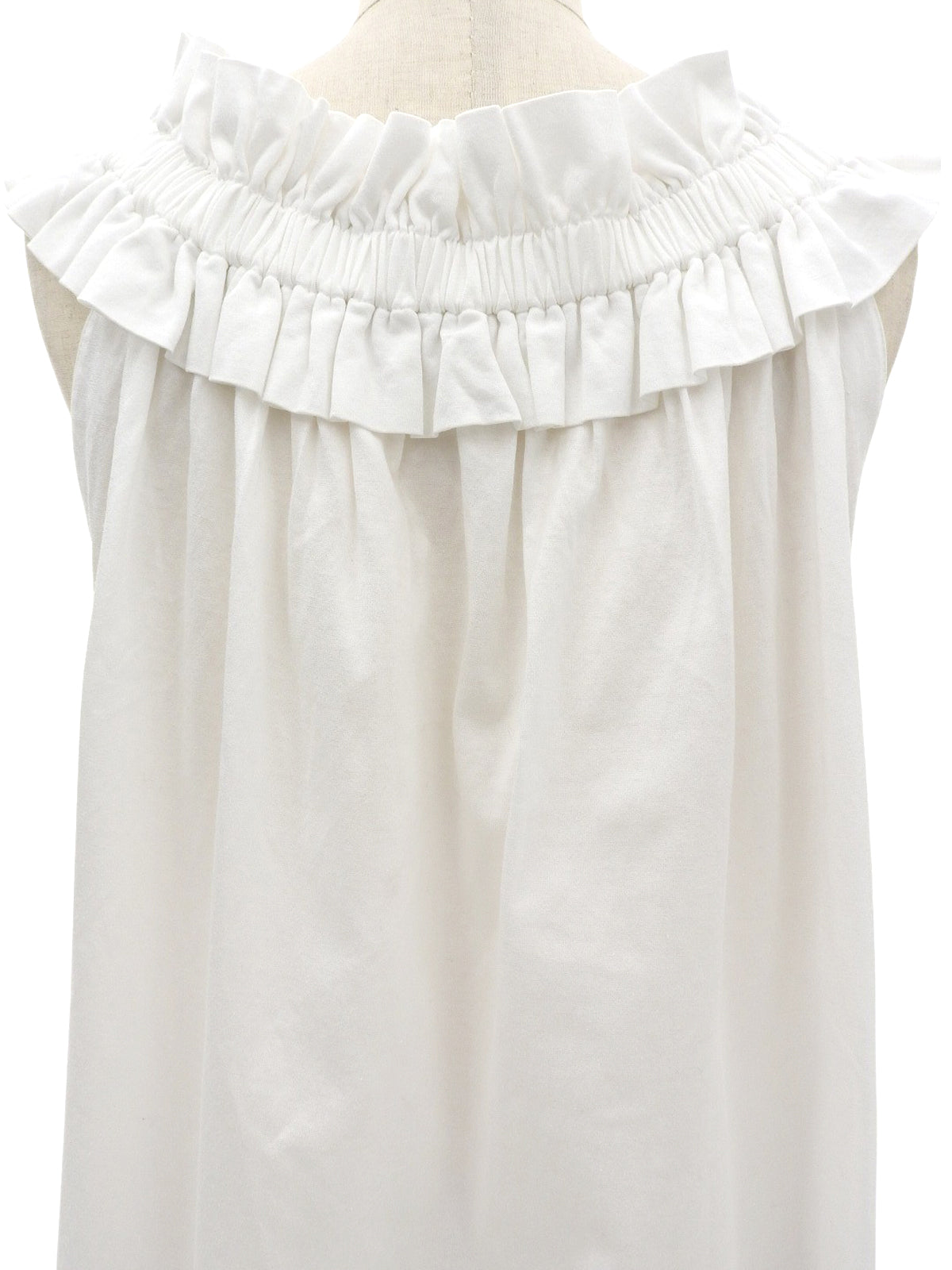 White ruffle sleeveless top