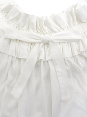 White ruffle sleeveless top