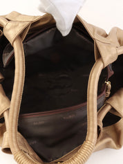 Nappa Aire Anagram Embossed Handbag in Gold