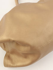 Nappa Aire Anagram Embossed Handbag in Gold