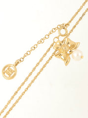 Pearl ribbon motif necklace gold