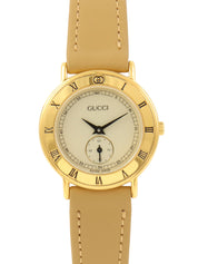 ラウンドロゴフェイスウォッチ ゴールド/ベージュ