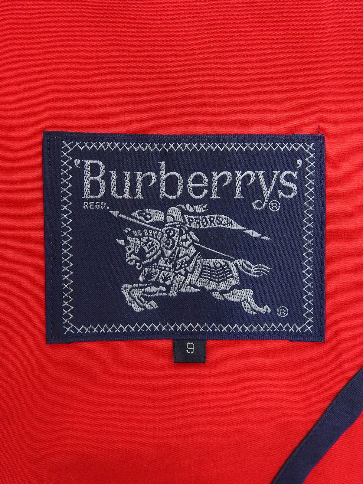 ロゴボタンステンカラーコート レッド