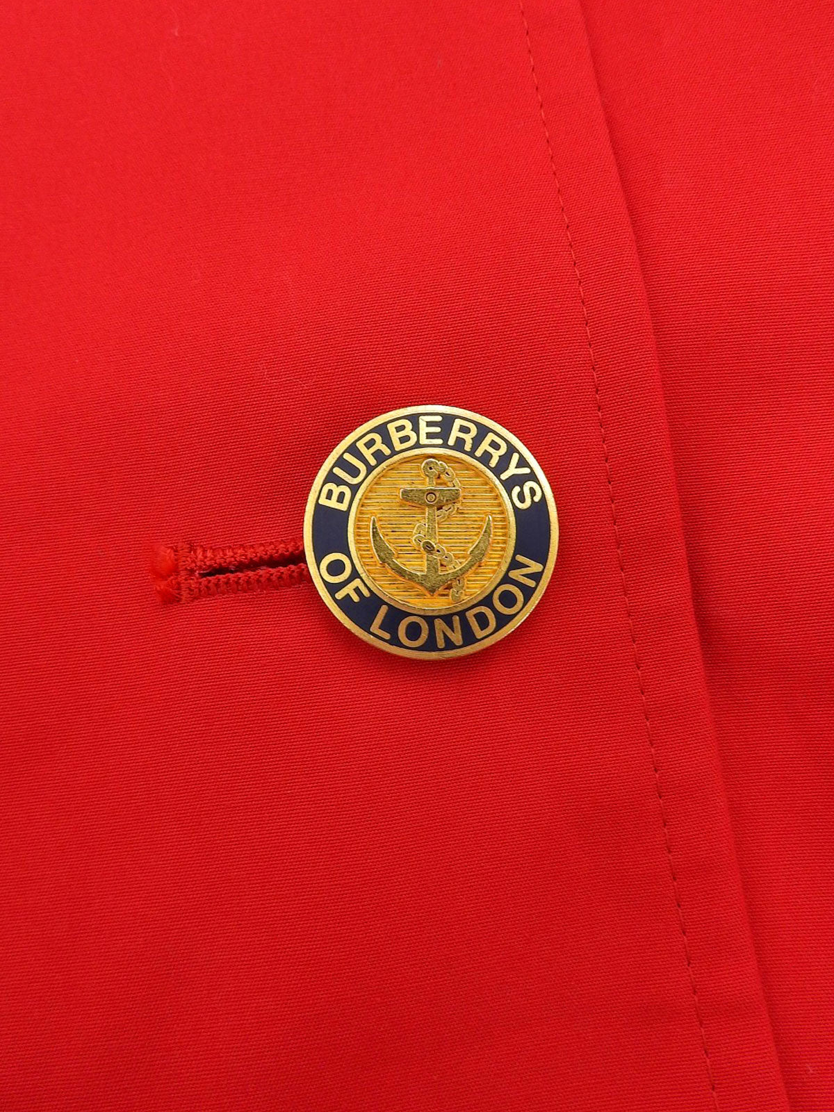 ロゴボタンステンカラーコート レッド