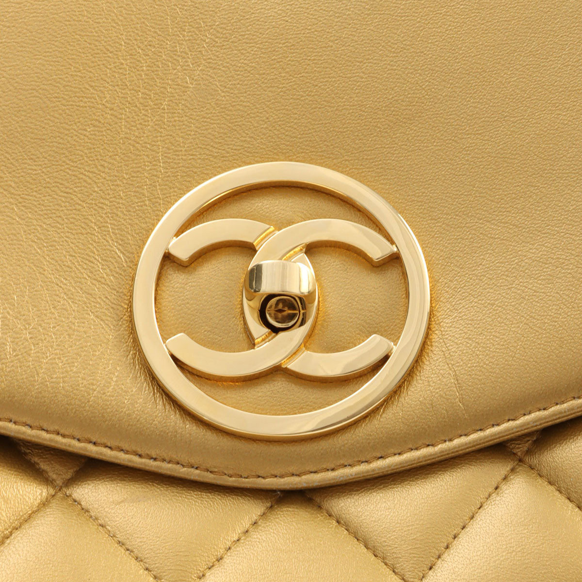 Circa 1992 Circle CC Turn-lock Backpack, Gold