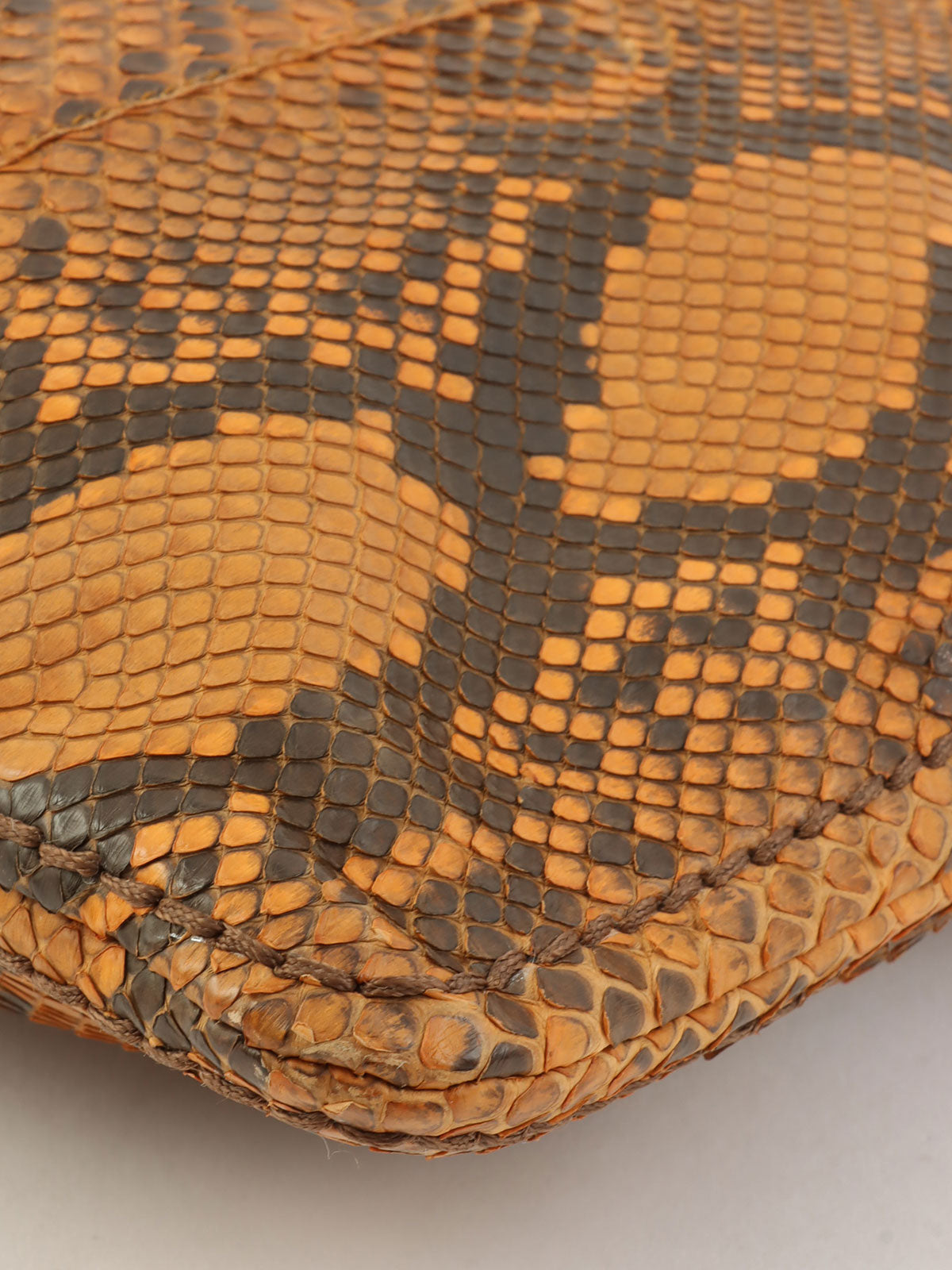 Python logo plate clutch bag in orange