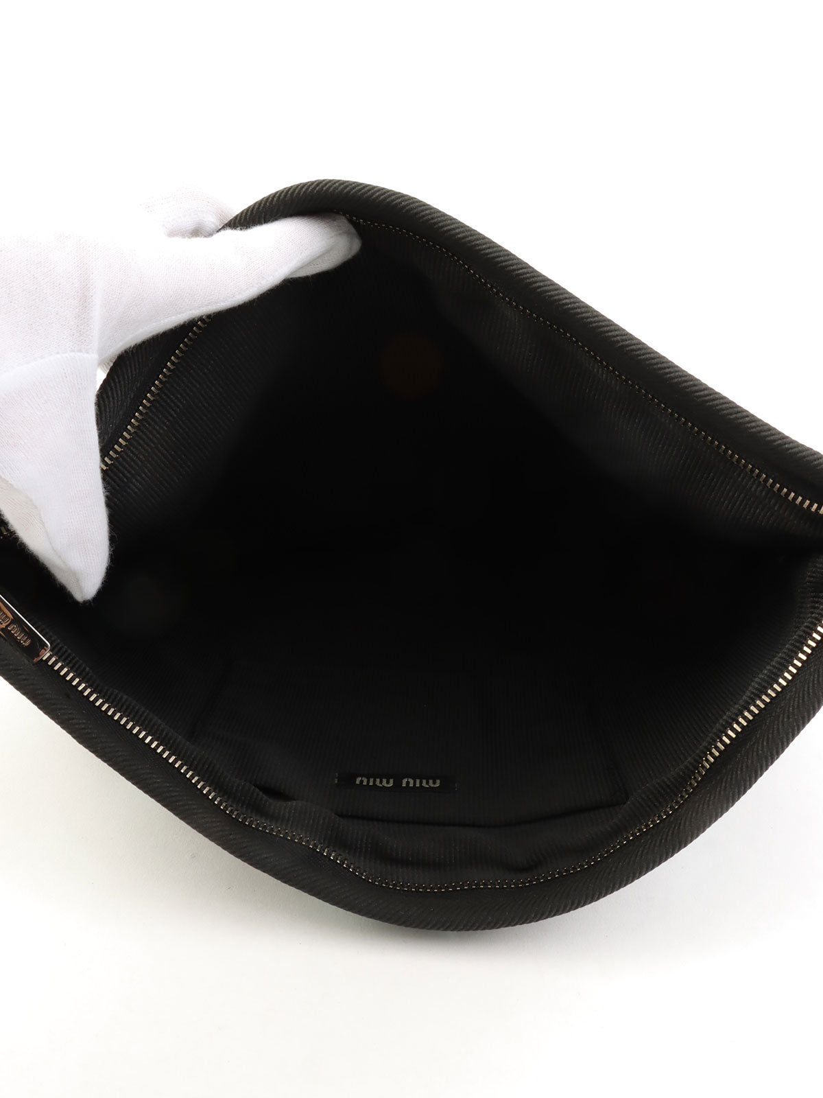 Sequined clutch bag in black/dark green