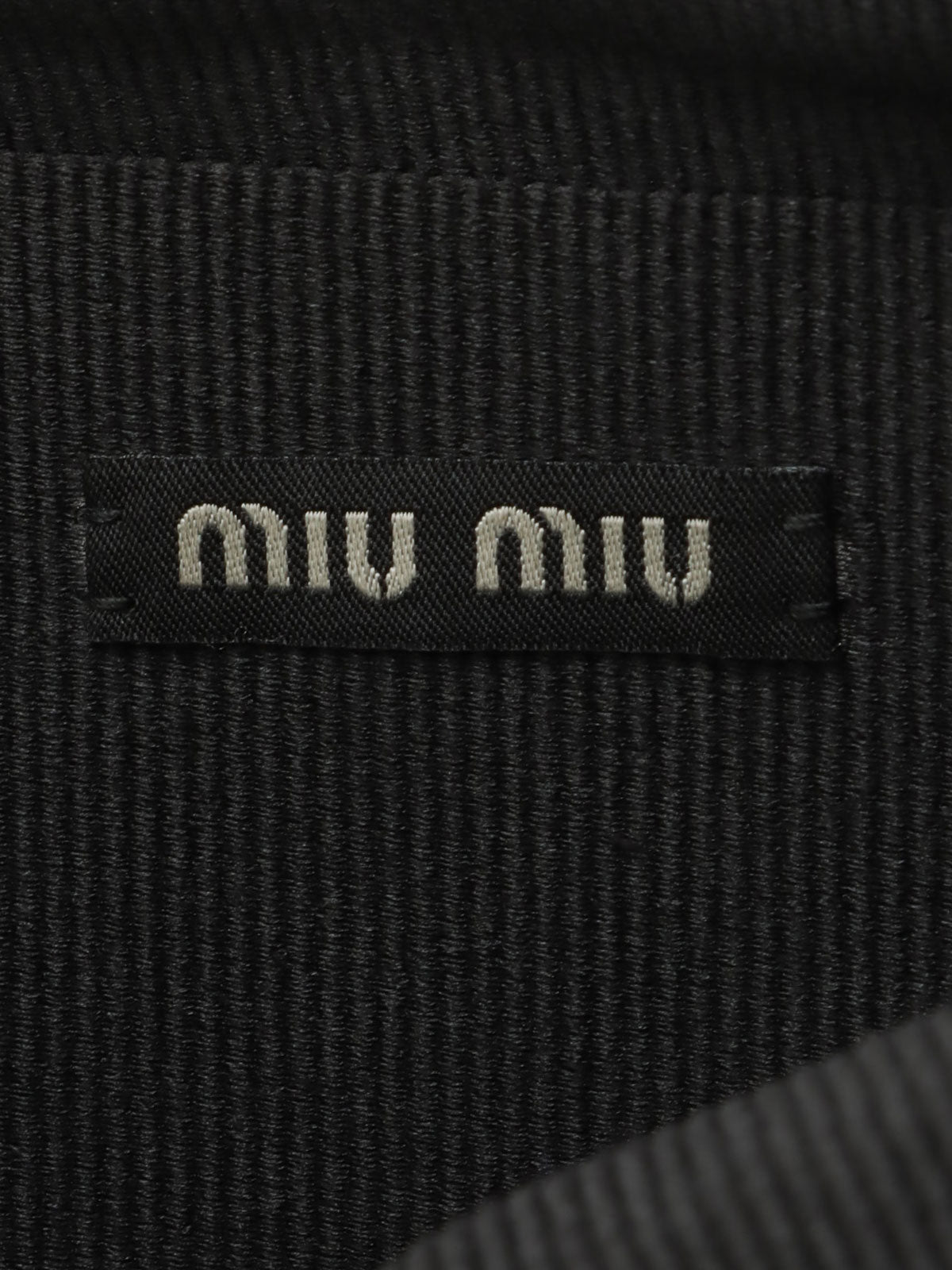 Sequined clutch bag in black/dark green