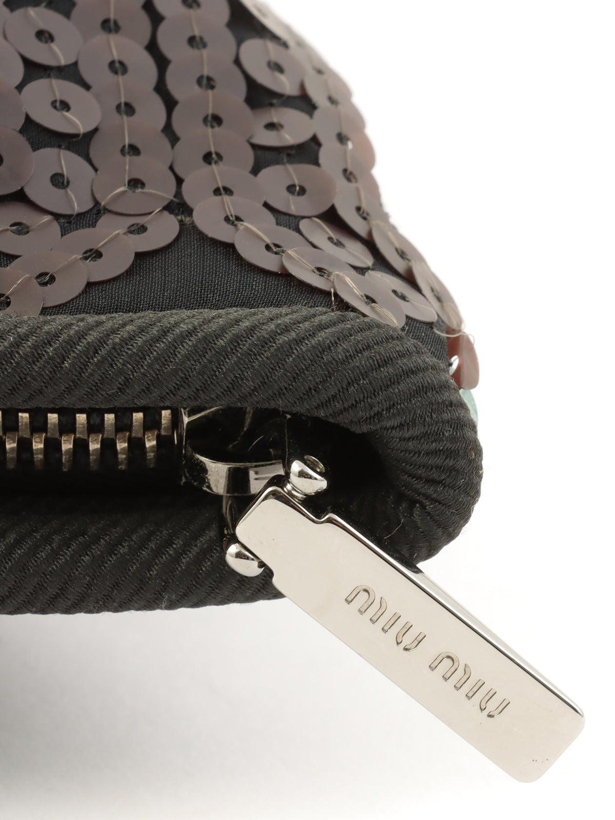 Sequined clutch bag in black/dark green