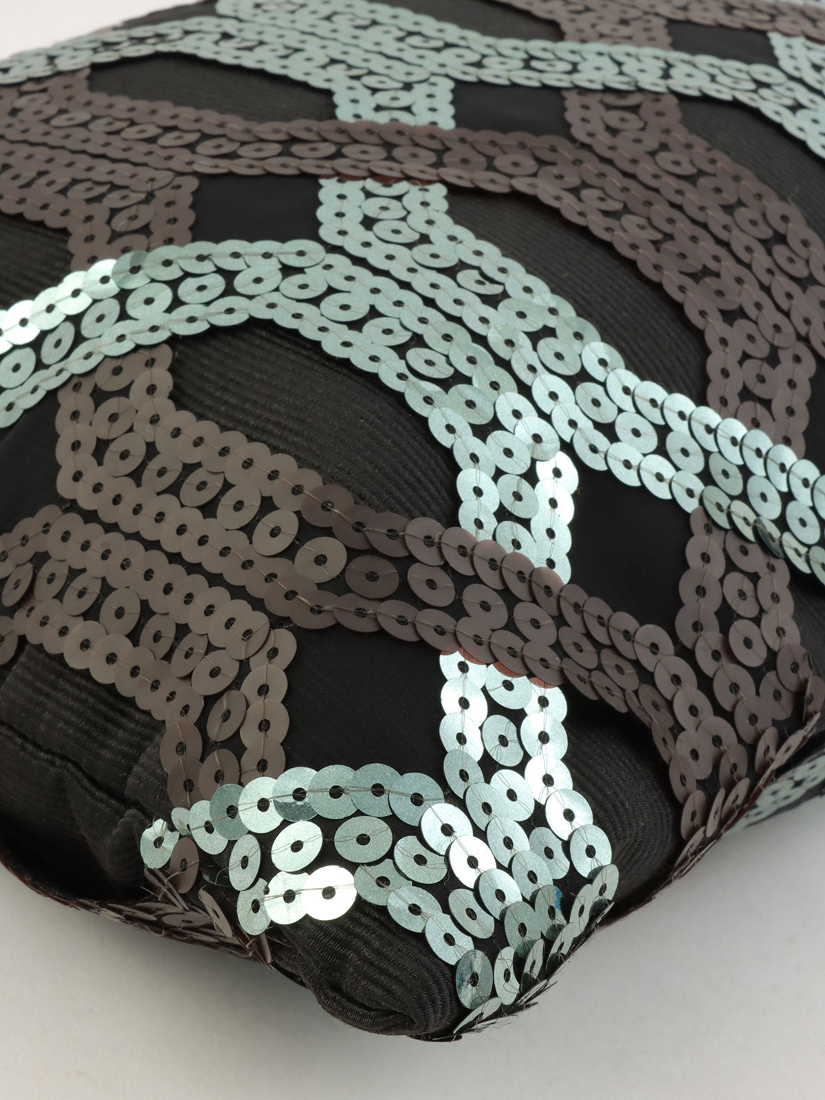 Sequined clutch bag in black/dark green