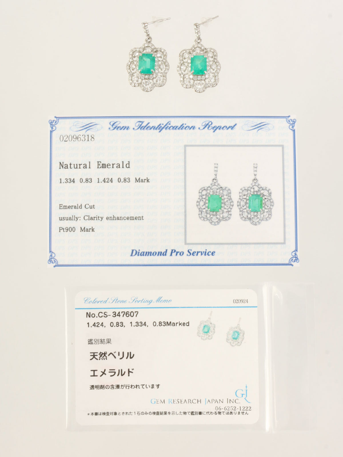 Platinum emerald and diamond design earrings in silver/green