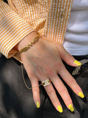 2001年製 CCマークラインストーンリング付きバングル ゴールド