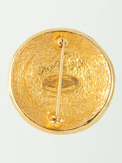 Round logo design brooch in gold